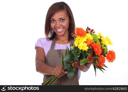 young black female florist taking a flowers bouquet