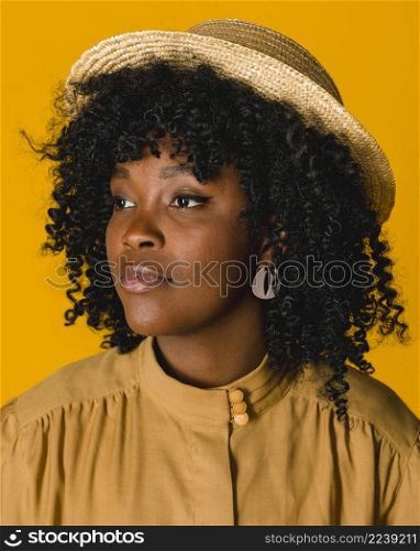 young black woman straw hat looking away