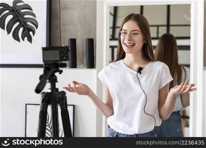 young blogger recording with professional camera mic