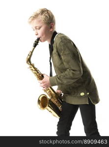 young blond boy and saxophone in studio against white background