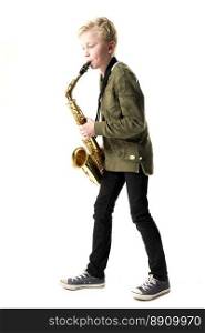 young blond boy and saxophone in studio against white background