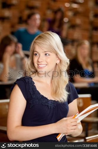 Young blond college girl looking of to the side