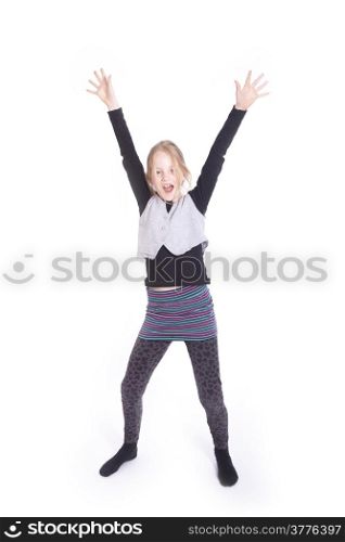 young blond girl cheering with raised arms in studio against white background