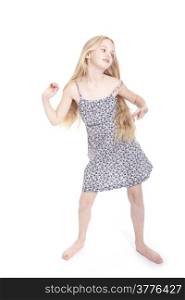young blond girl dancing in studio against white background
