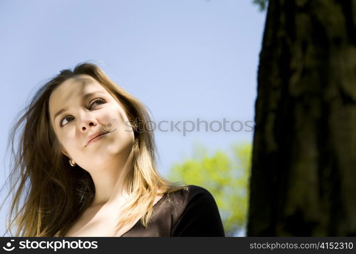 Young Blond Girl Enjoying The Sun.