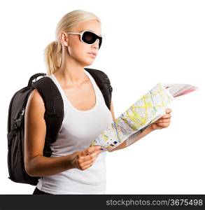 young blond girl with sunglasses looking at map isolated on white