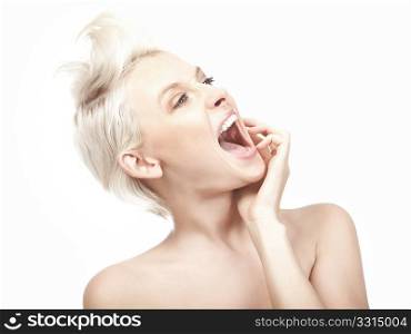 Young blond woman crazily screaming