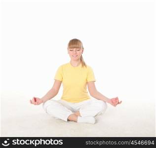 young blond woman doing yoga exercise indoors