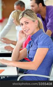 Young blond woman in business training