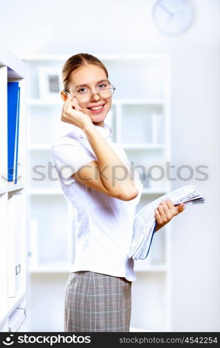 Young blond woman in business wear in office environment