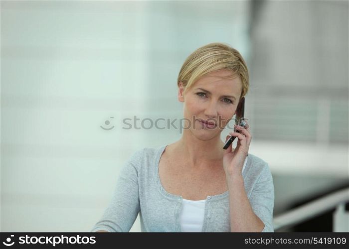 Young blond woman on the phone