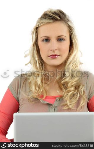 Young blond woman using laptop computer