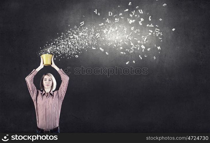 Young blond woman with yellow bucket in hands. Woamn splashing charcters from bucket
