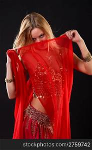 Young blonde belly dancer in red.