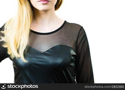 Young blonde fashionable pretty woman wearing black leather top. Female being fashionable.. Happy woman wearing black top