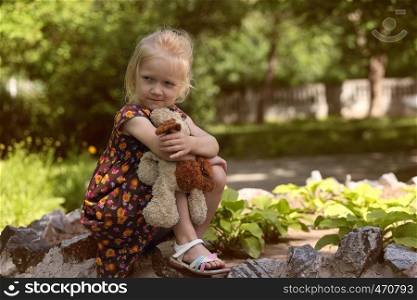 young blonde girl at the nature