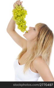 young blonde girl eating grapes. Isolated on white background