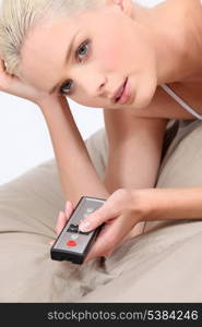 Young blonde with remote control
