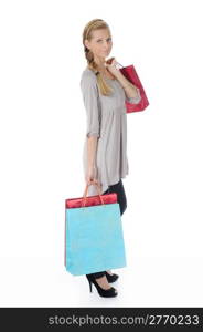 young blonde woman in a full-length with a paper shopping bags. Isolated on white background