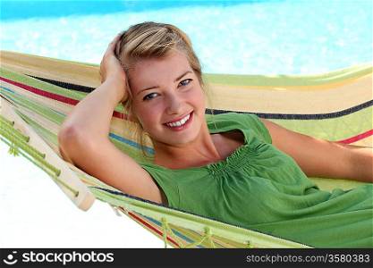 young blonde woman in a hammock