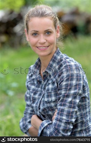 young blonde woman portrait in nature