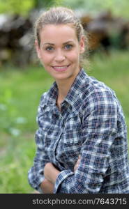 young blonde woman portrait in nature