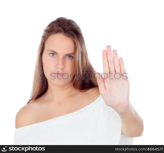 Young blonde woman requiring stop with her hand isolated on a white background