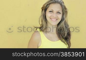 Young blonde woman smiling at camera