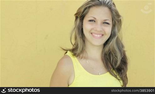 Young blonde woman smiling at camera