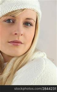 young blonde woman wearing a winter hat