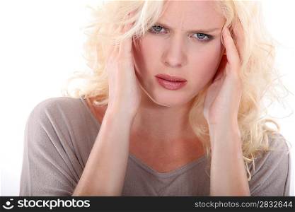 Young blonde woman with a headache