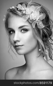 Young blonde woman with tiara on her head. Black and white photo. Beautiful model woman with curly hairstyle. Care and beauty hair products. Perfect make-up