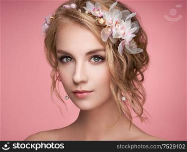 Young blonde woman with tiara on her head. Blonde girl with elegant and shiny hairstyle. Beautiful model woman with curly hairstyle. Care and beauty hair products. Perfect make-up