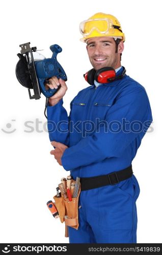 young blue collar with protective equipment and sander machine