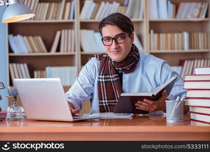 Young book writer writing in library