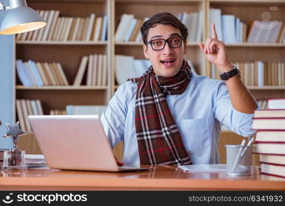 Young book writer writing in library