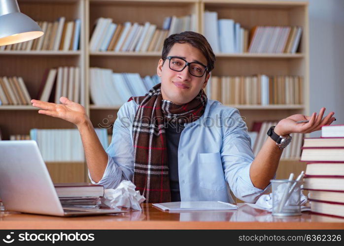 Young book writer writing in library