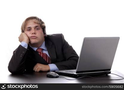 young bored business man working with is laptop