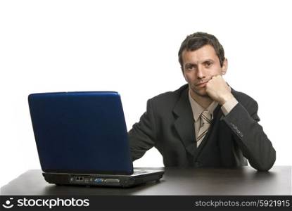 young bored business man working with is laptop