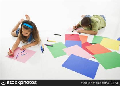 Young boy and girl drawing