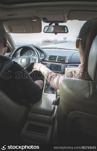 Young boy and girl driving a car. Car interior