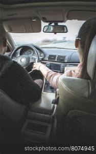 Young boy and girl driving a car. Car interior