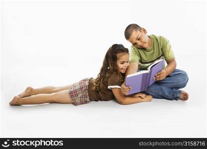 Young boy and girl reading