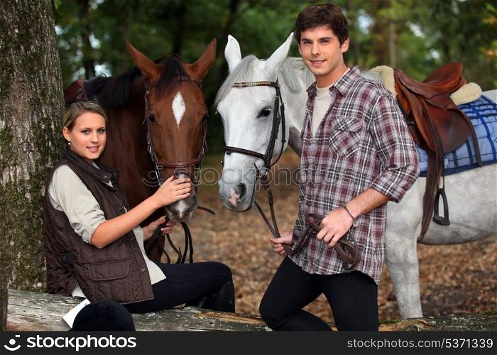 young boy and girl riding horses