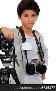 Young boy as a press photographer