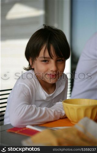 Young boy at the breakfast table