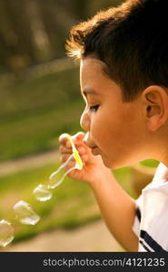 Young Boy Blowing Bubbles