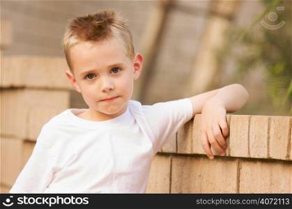 Young boy by a swimming pool