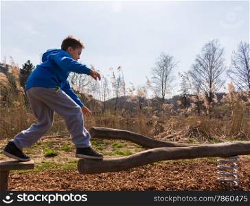 Young boy climbing on playground