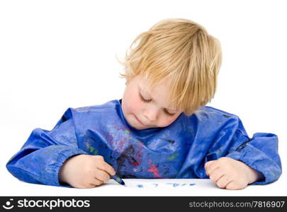Young boy concentrating on his drawing